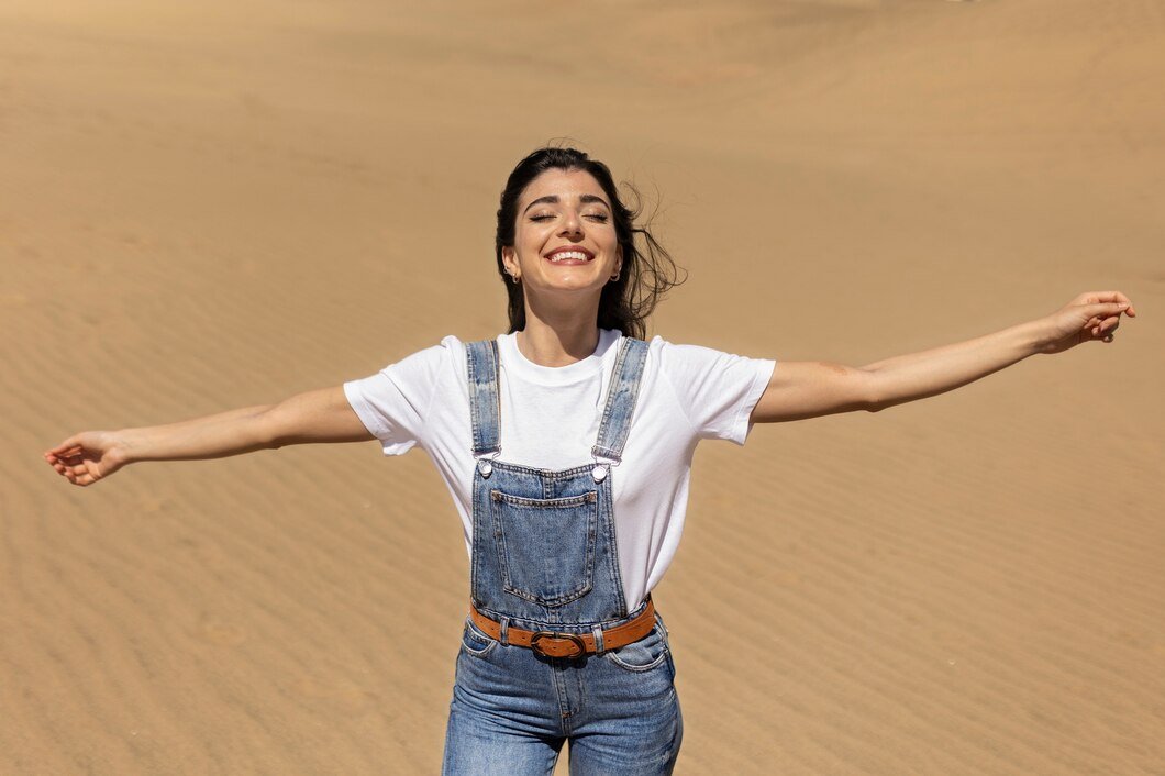 medium-shot-smiley-woman-desert_23-2149408641