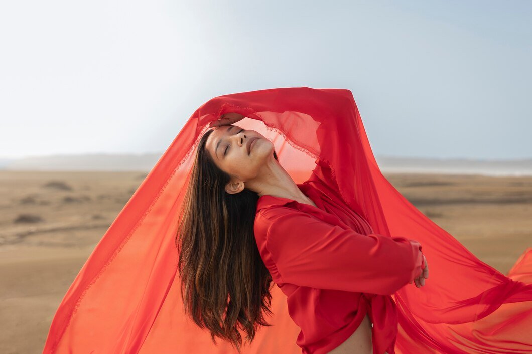 medium-shot-woman-throwing-red-scarf_23-2149408651